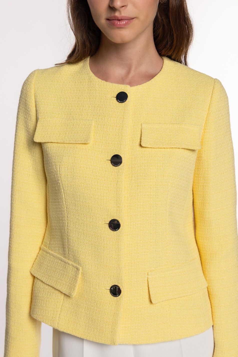 Casaco de tweed com bolsillos de tapeta